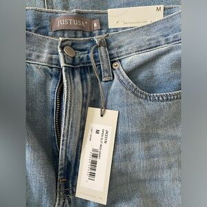 Denim skirt. Brand new with tags. Size medium (4:6)